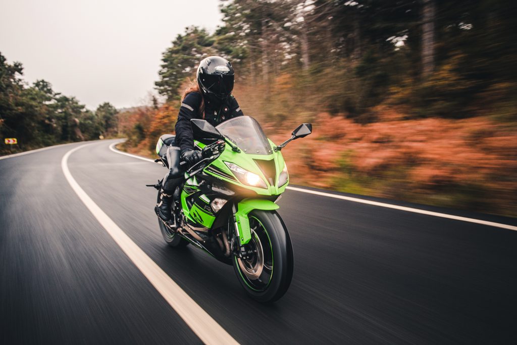 driving green neon color motorcycle road